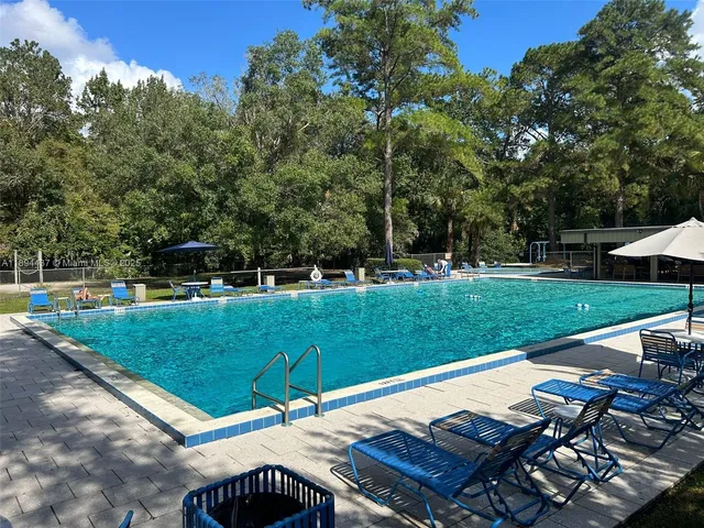 a view of a table and chairs under an umbrella