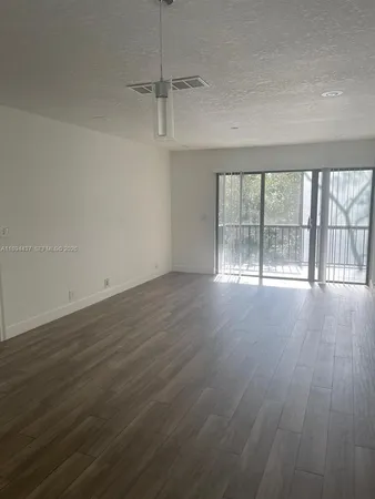 a view of small space with wooden floor