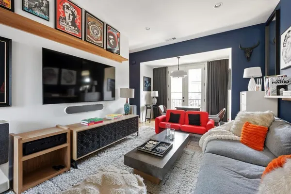 a living room with furniture and a flat screen tv