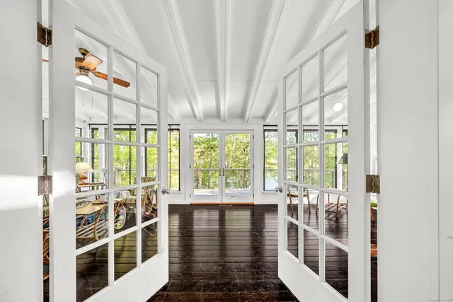 a view of a living room and balcony