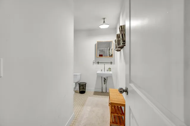 a bathroom with a sink and mirror