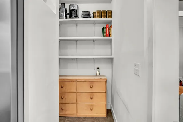 a room with a closet and wooden floor