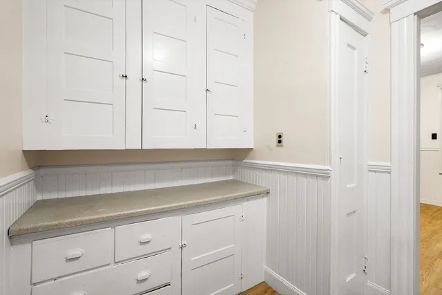a bathroom with a sink and cabinets