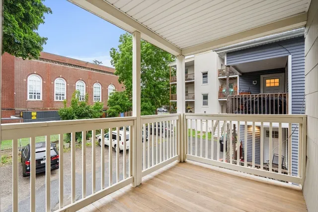 a view of a brick house with a large window