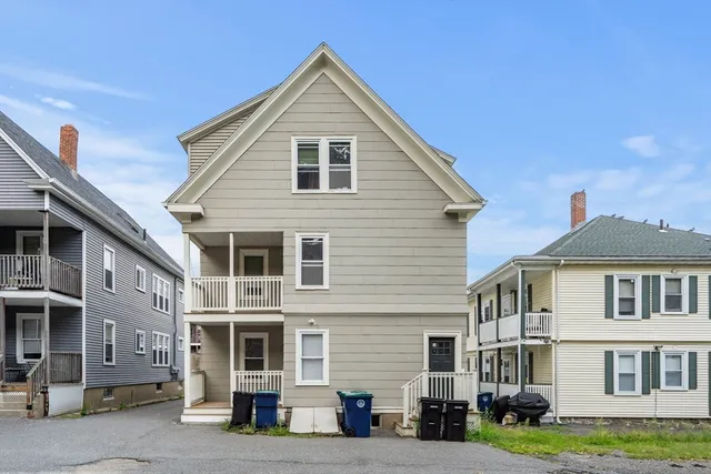 a front view of residential houses with yard