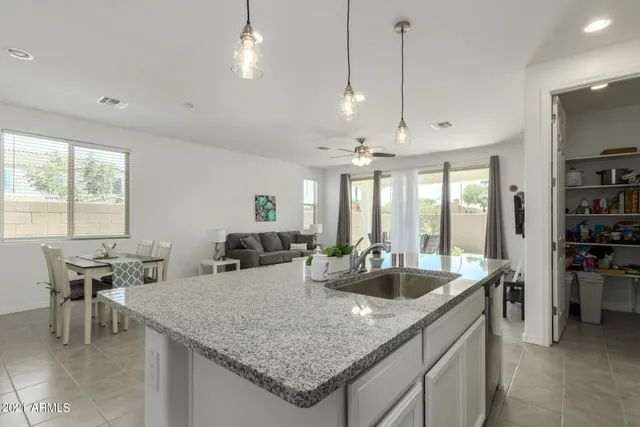 a kitchen with a stove and cabinets