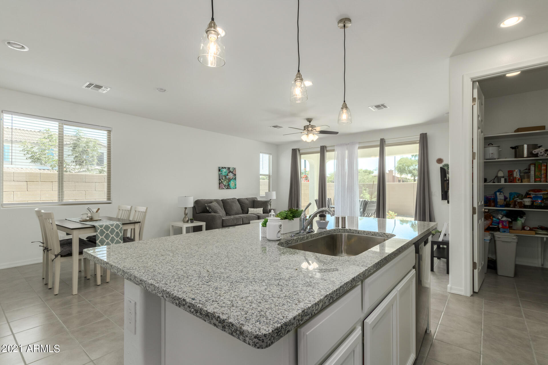 1507 South Honeysuckle Lane Gilbert, AZ 85296 - Photo 12 of 32 a kitchen with center island table and chairs