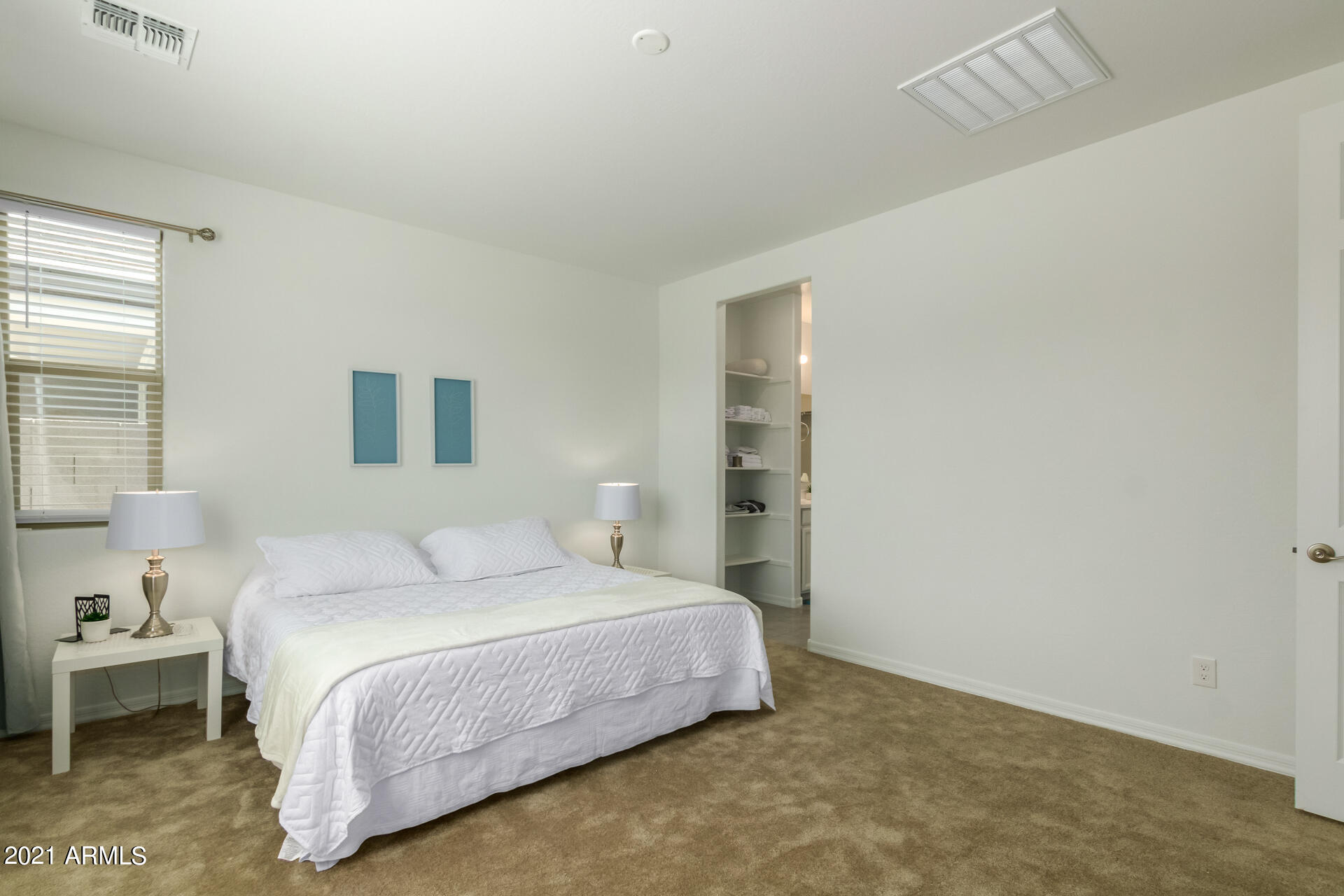 1507 South Honeysuckle Lane Gilbert, AZ 85296 - Photo 17 of 32 a bedroom with a bed and a night stand