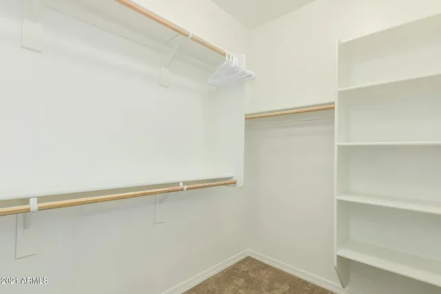 a bed room with a bed and a window