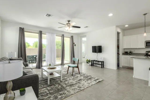 a living room with furniture and a large window