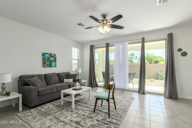 a large kitchen with kitchen island furniture and windows