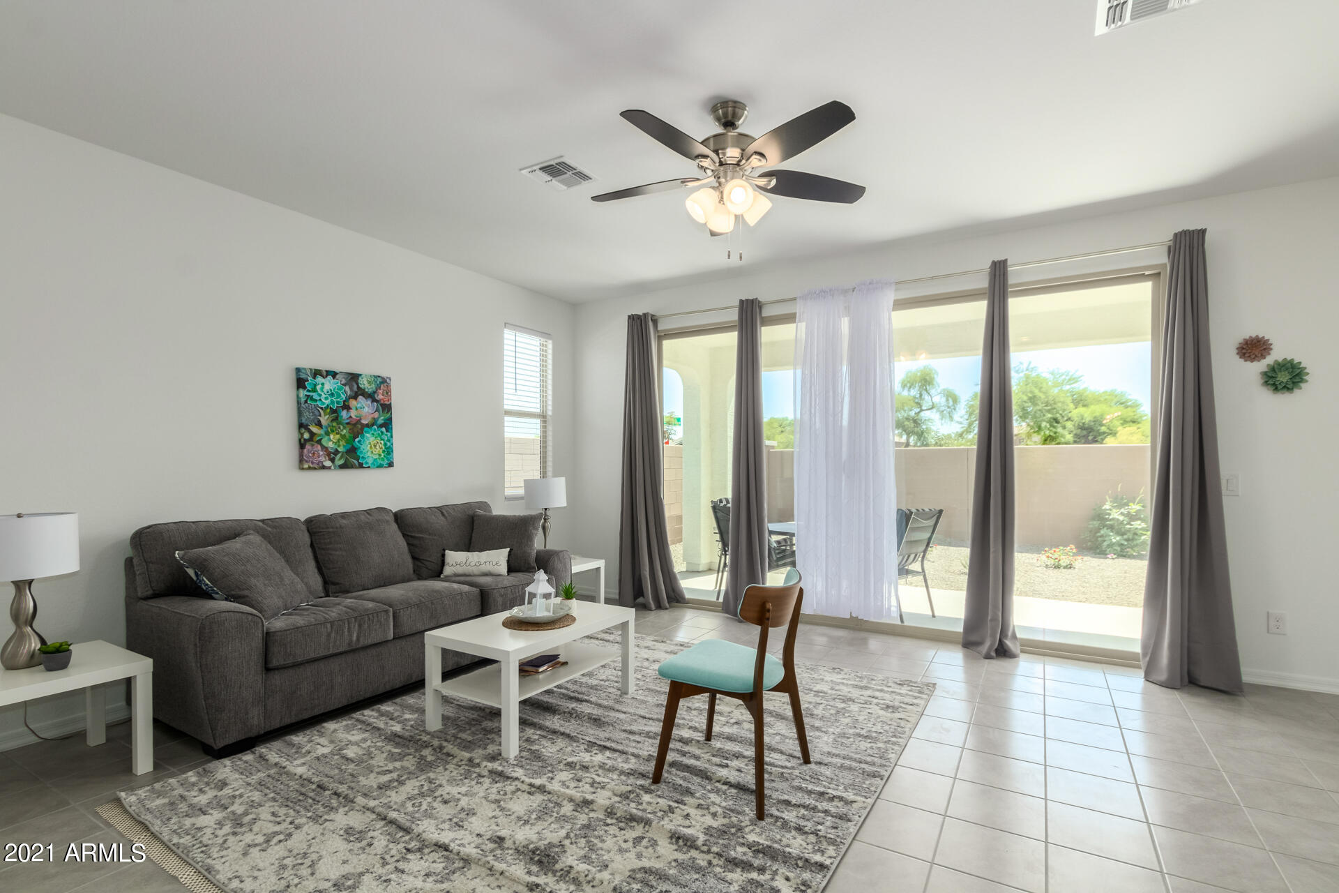 1507 South Honeysuckle Lane Gilbert, AZ 85296 - Photo 7 of 32 a living room with furniture and a large window