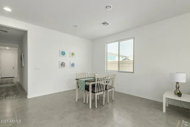 a kitchen with center island table and chairs in it