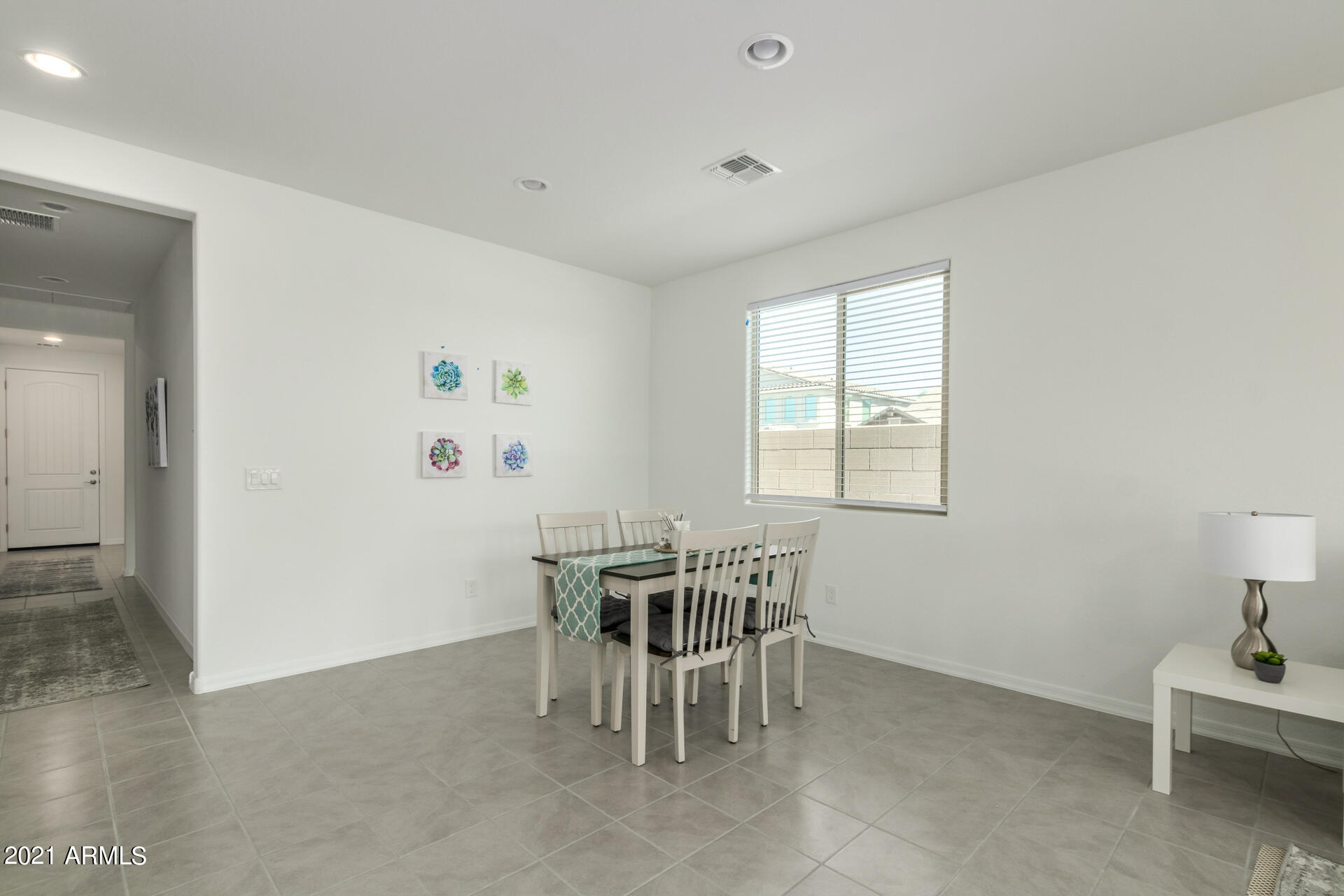 1507 South Honeysuckle Lane Gilbert, AZ 85296 - Photo 10 of 32 a table and chairs in a room