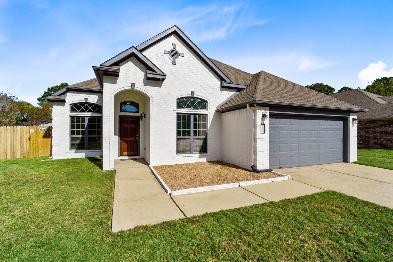front view of a house with a yard