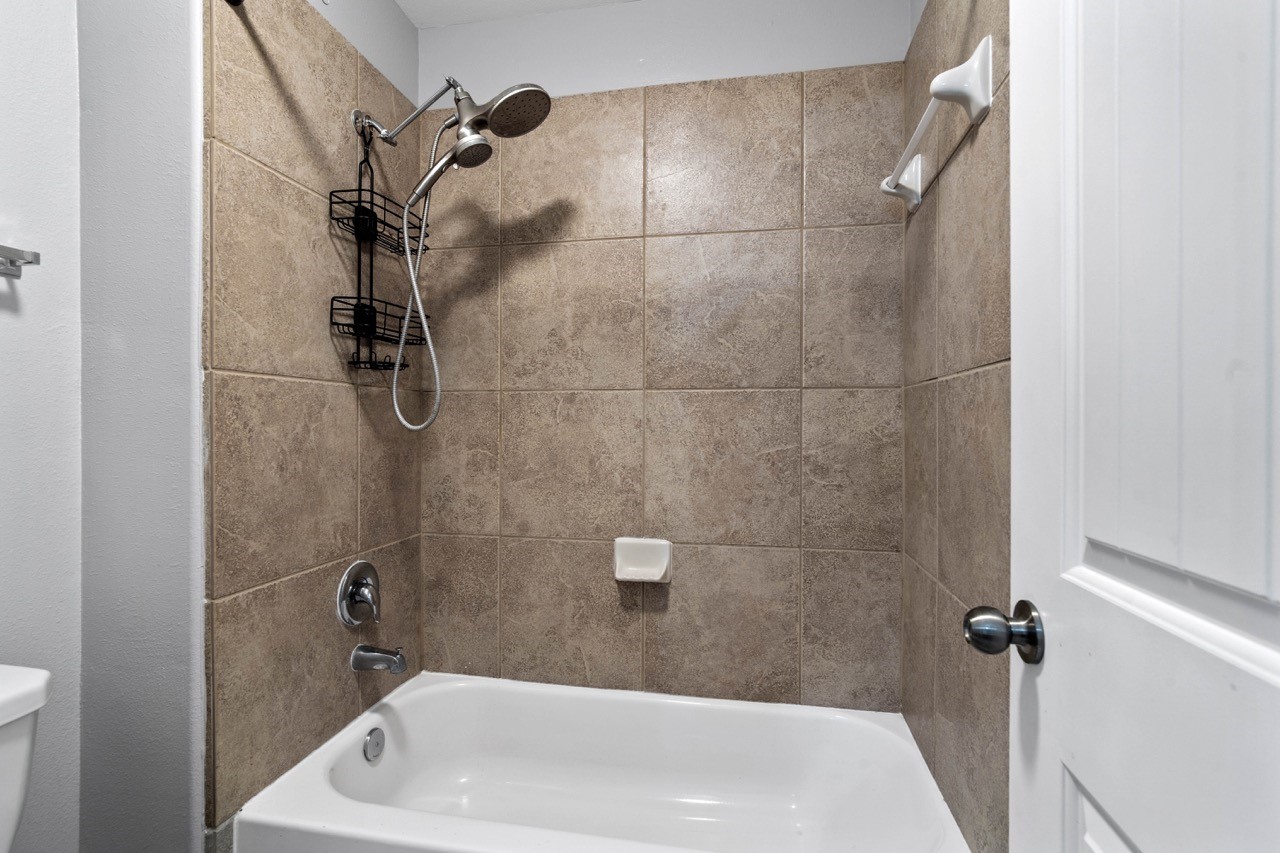 12126 Walden Road Montgomery, TX 77356 - Photo 12 of 50 Tub shower combo with dual shower heads.