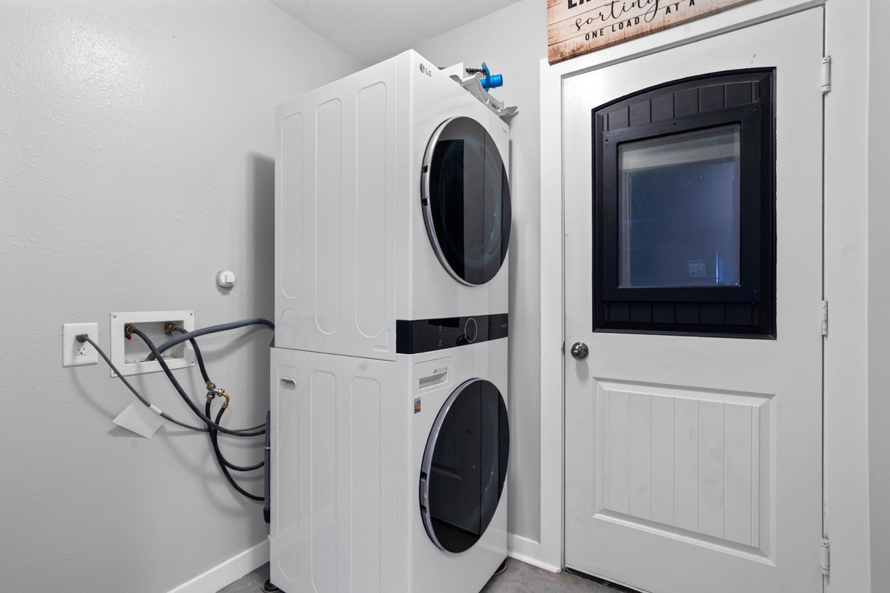 12126 Walden Road Montgomery, TX 77356 - Photo 13 of 50 Washer and dryer will convey with the home. Door leads to the garage.