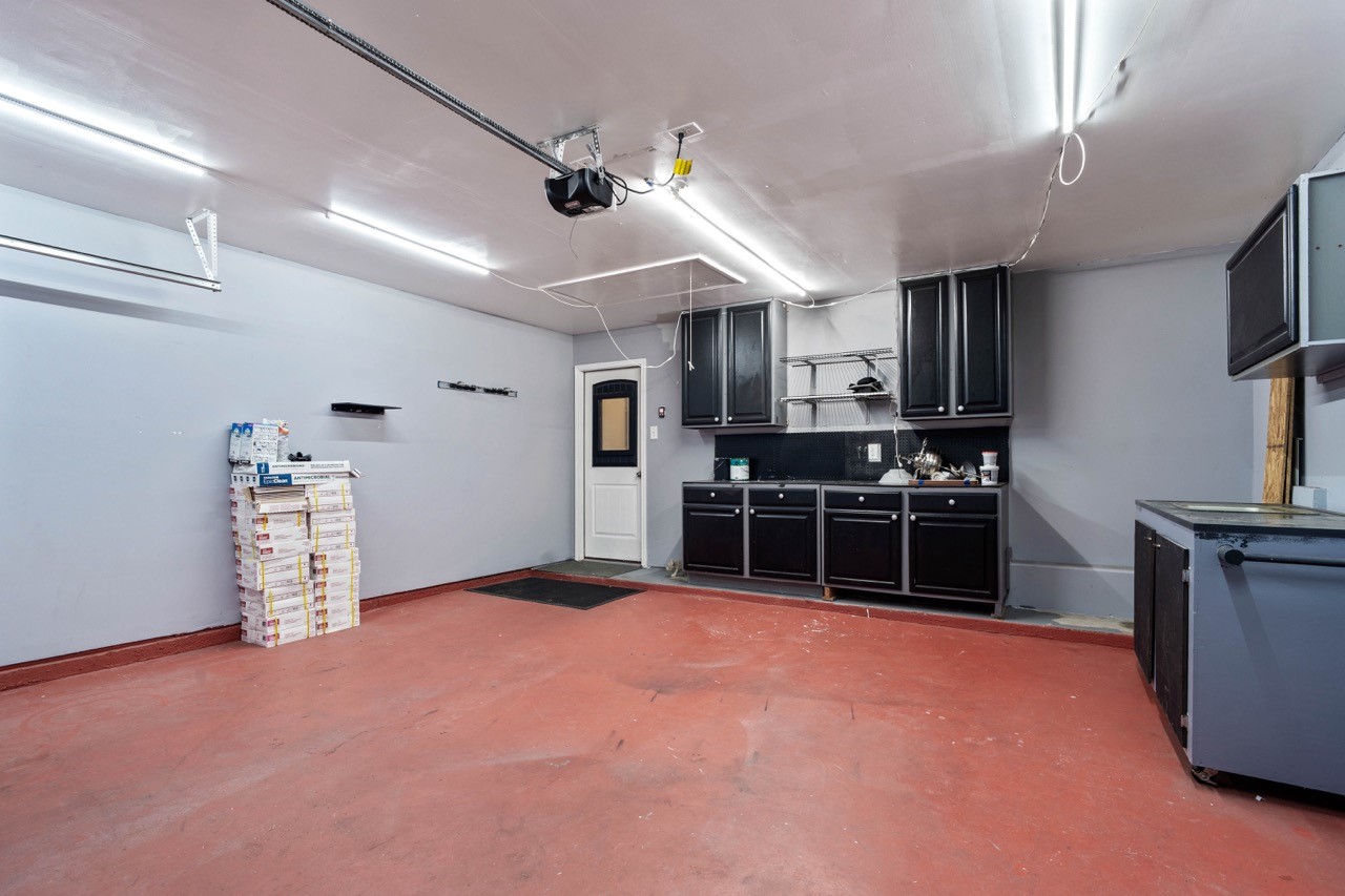 12126 Walden Road Montgomery, TX 77356 - Photo 14 of 50 2 car attached garage with ample workstation and cabinet storage. New garage door opener and rollers.