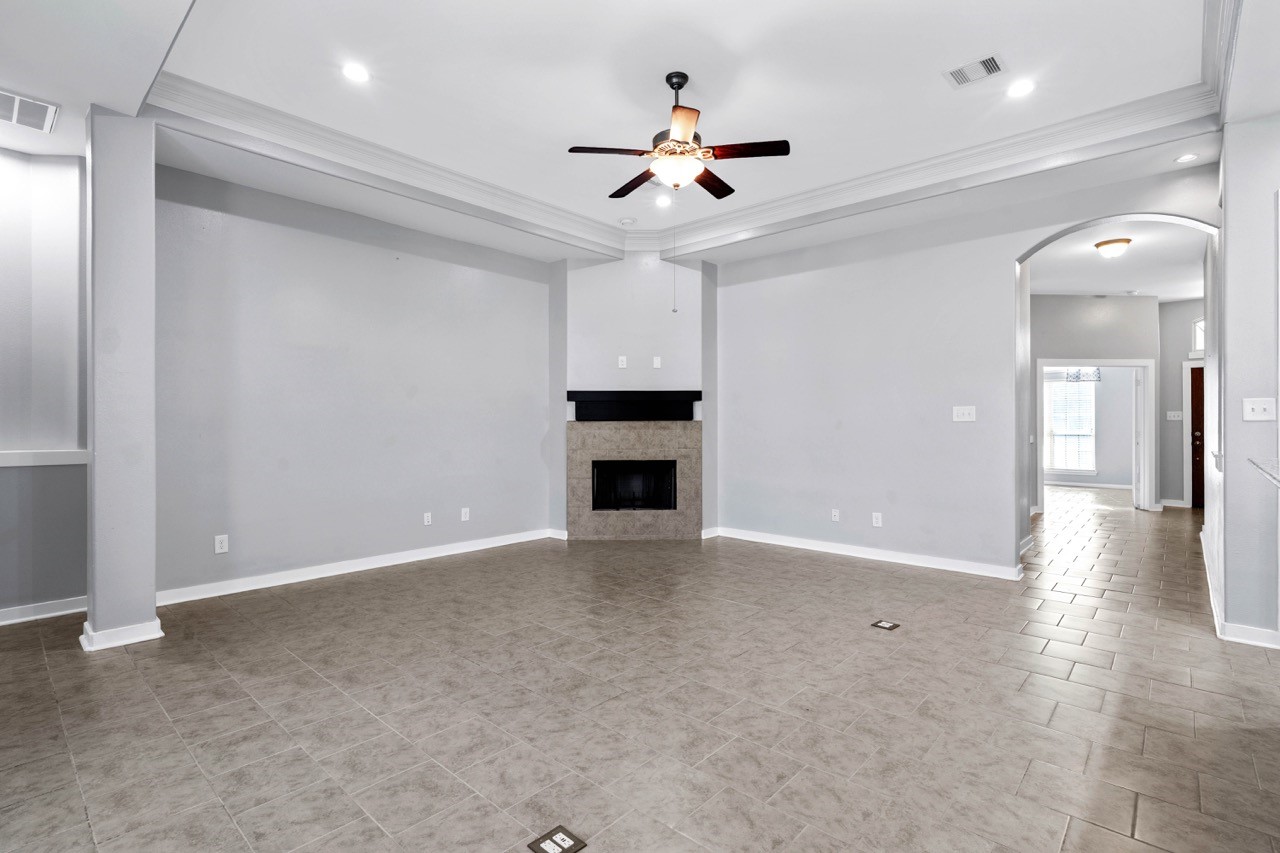 12126 Walden Road Montgomery, TX 77356 - Photo 18 of 50 Spacious living area with easy access to the primary room, kitchen and entryway. Cozy up with a warm crackling fire on those chilly nights! New paint throughout home (2021) and home offers all LED lighting. Notice the outlets in the floor offering USB ports.