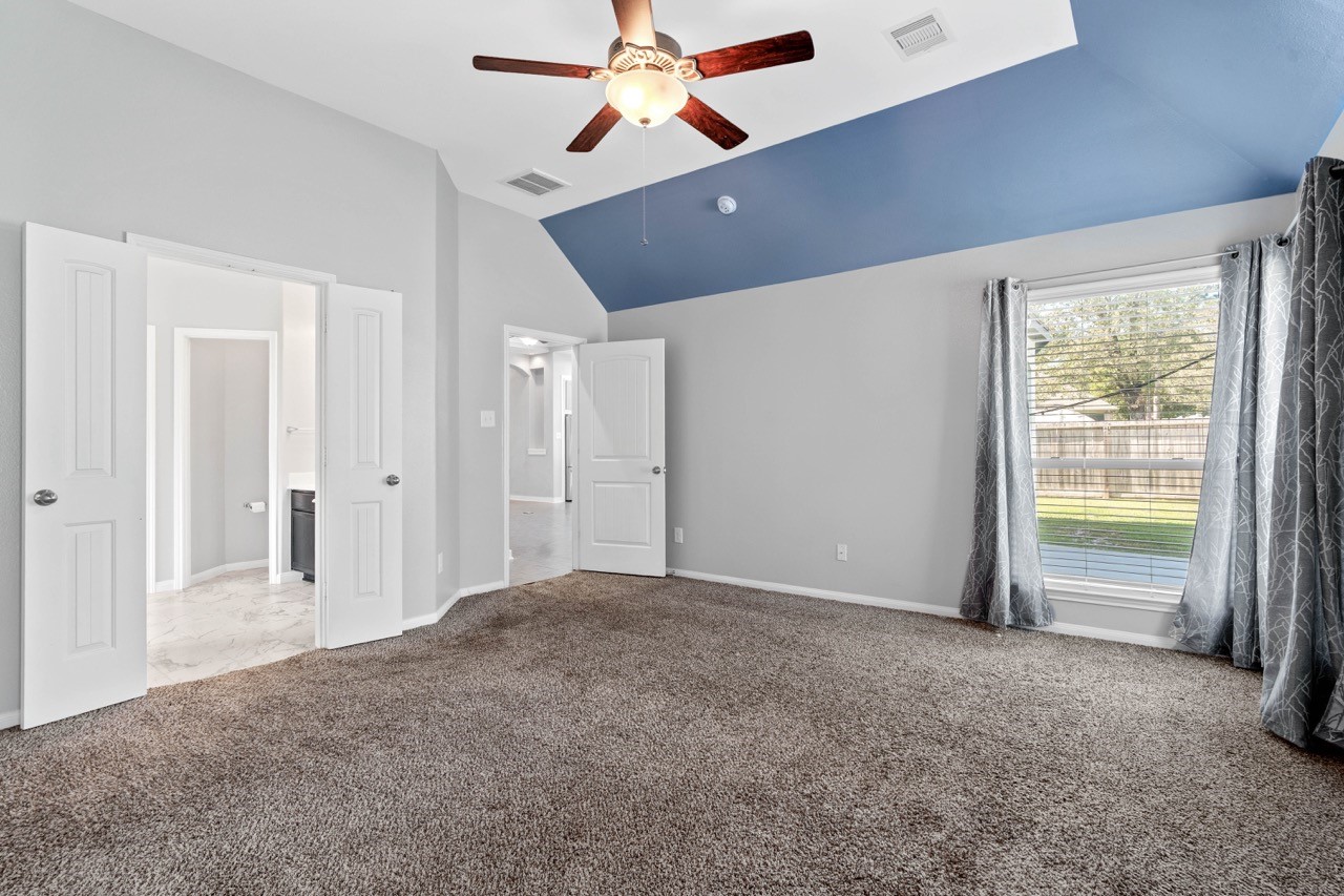12126 Walden Road Montgomery, TX 77356 - Photo 50 of 50 View from primary bedroom looking toward the remodeled primary bathroom and the door leading to the living room. This is a split floor plan with all other rooms toward the front of the home.