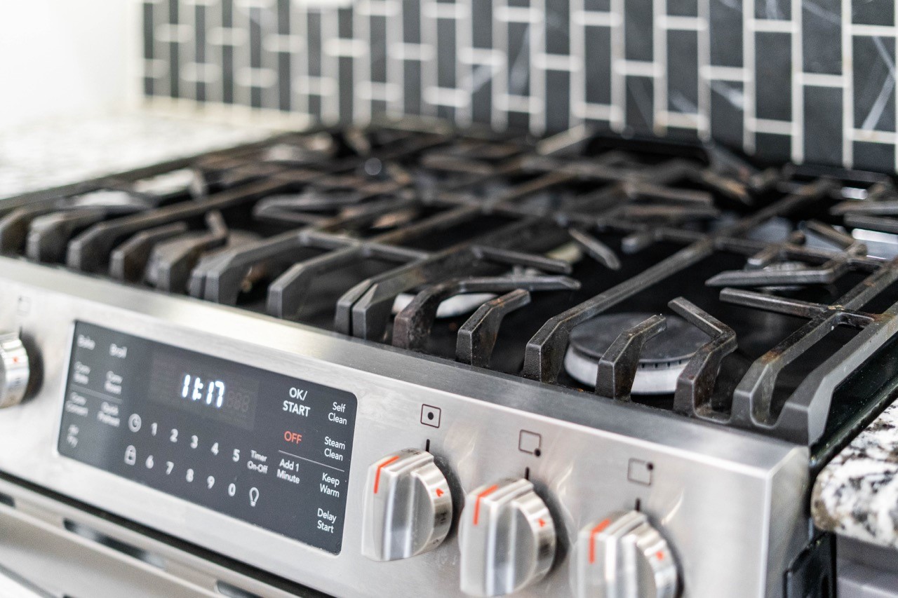 12126 Walden Road Montgomery, TX 77356 - Photo 34 of 50 Prepare meals with ease on the home’s upgraded kitchen stove, offering efficient heat, responsive controls, and a spacious cooking surface perfect for everyday use or entertaining. Whether simmering, sautéing, or baking, this appliance delivers reliable performance and enhances the functionality of the beautifully designed kitchen.