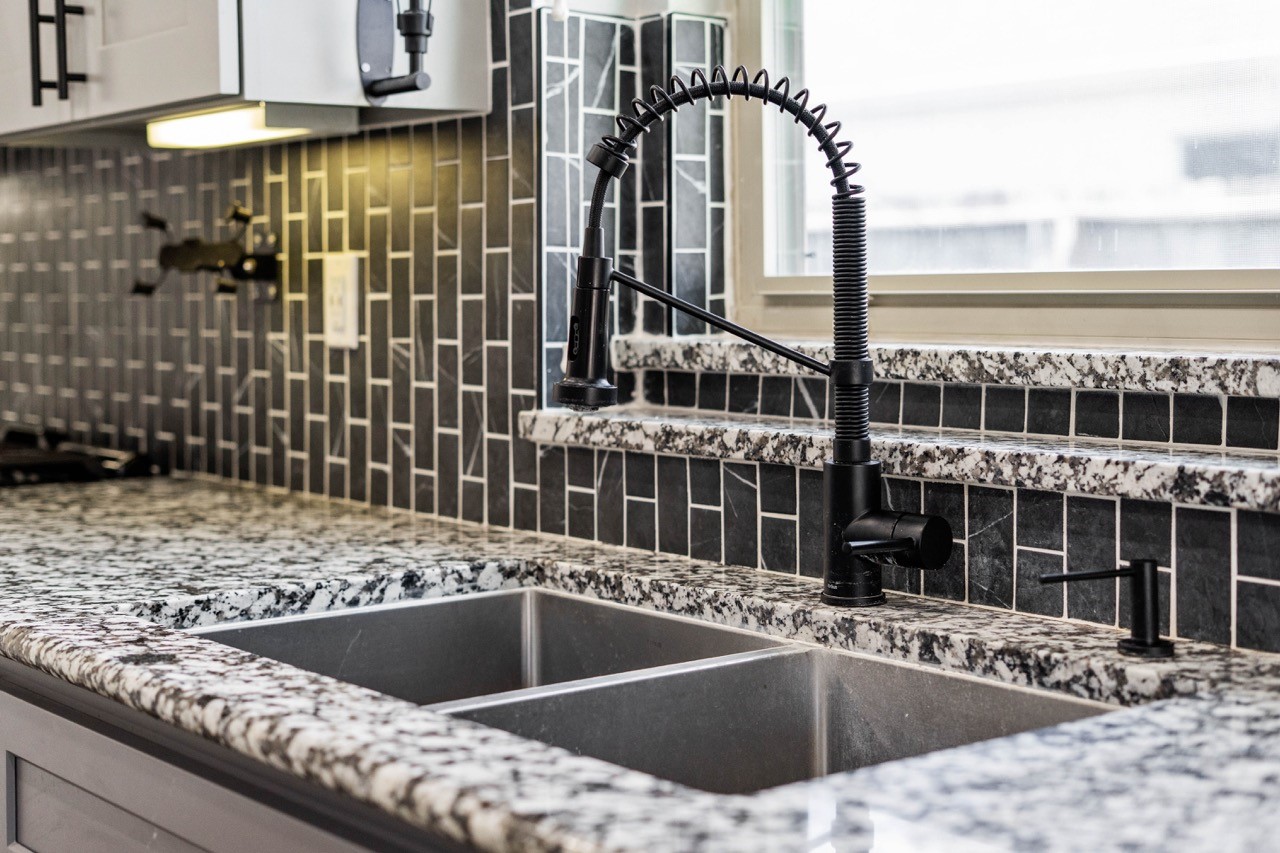 12126 Walden Road Montgomery, TX 77356 - Photo 35 of 50 Newly remodeled countertops and backsplash. New garbage disposal as well. Whole home water filter system is also in place.