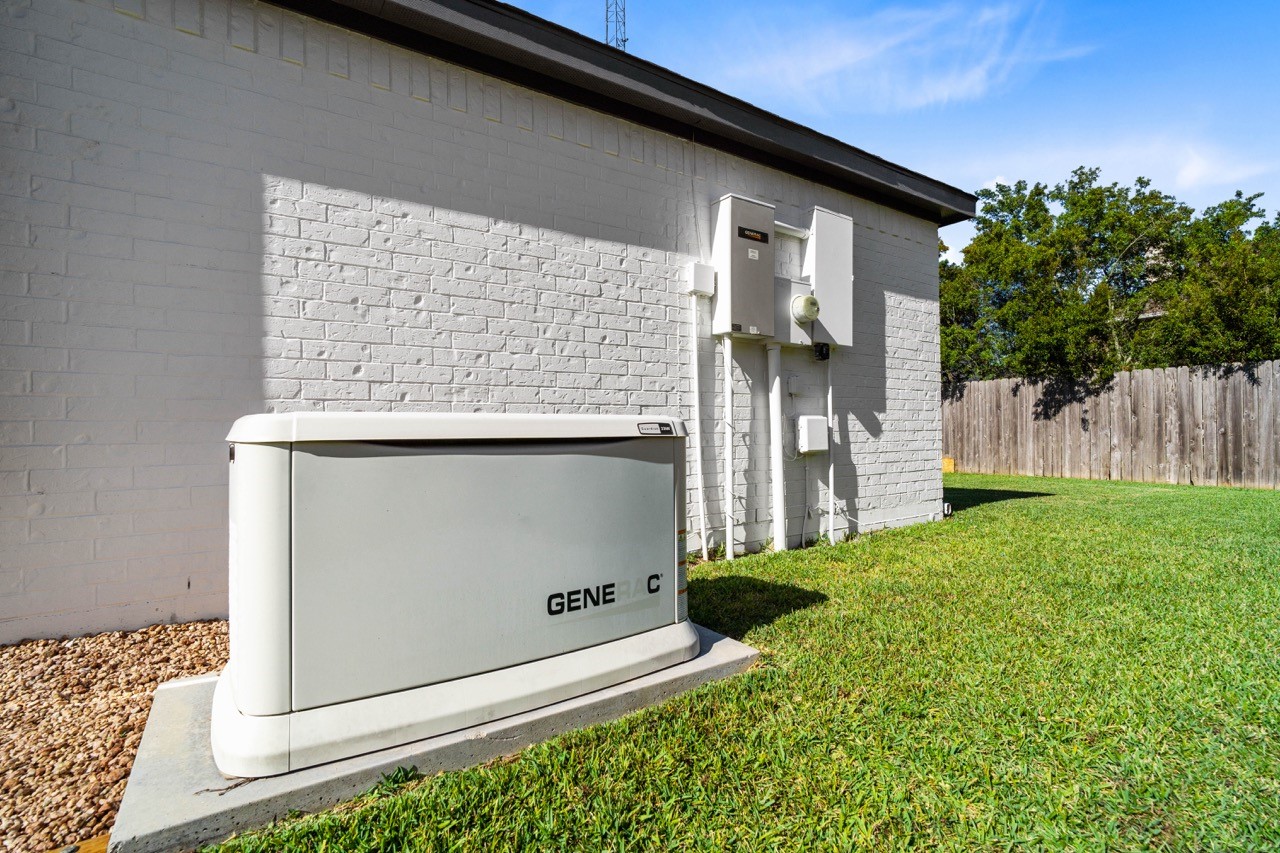 12126 Walden Road Montgomery, TX 77356 - Photo 41 of 50 This home is equipped with a powerful 22KW whole-home generator with Wifi and an added whole home surge protector that provides reliable, automatic backup power during outages. Designed to run the entire household seamlessly, this upgrade offers peace of mind, comfort, and uninterrupted functionality no matter the weather. A valuable feature that adds both security and convenience for homeowners.
