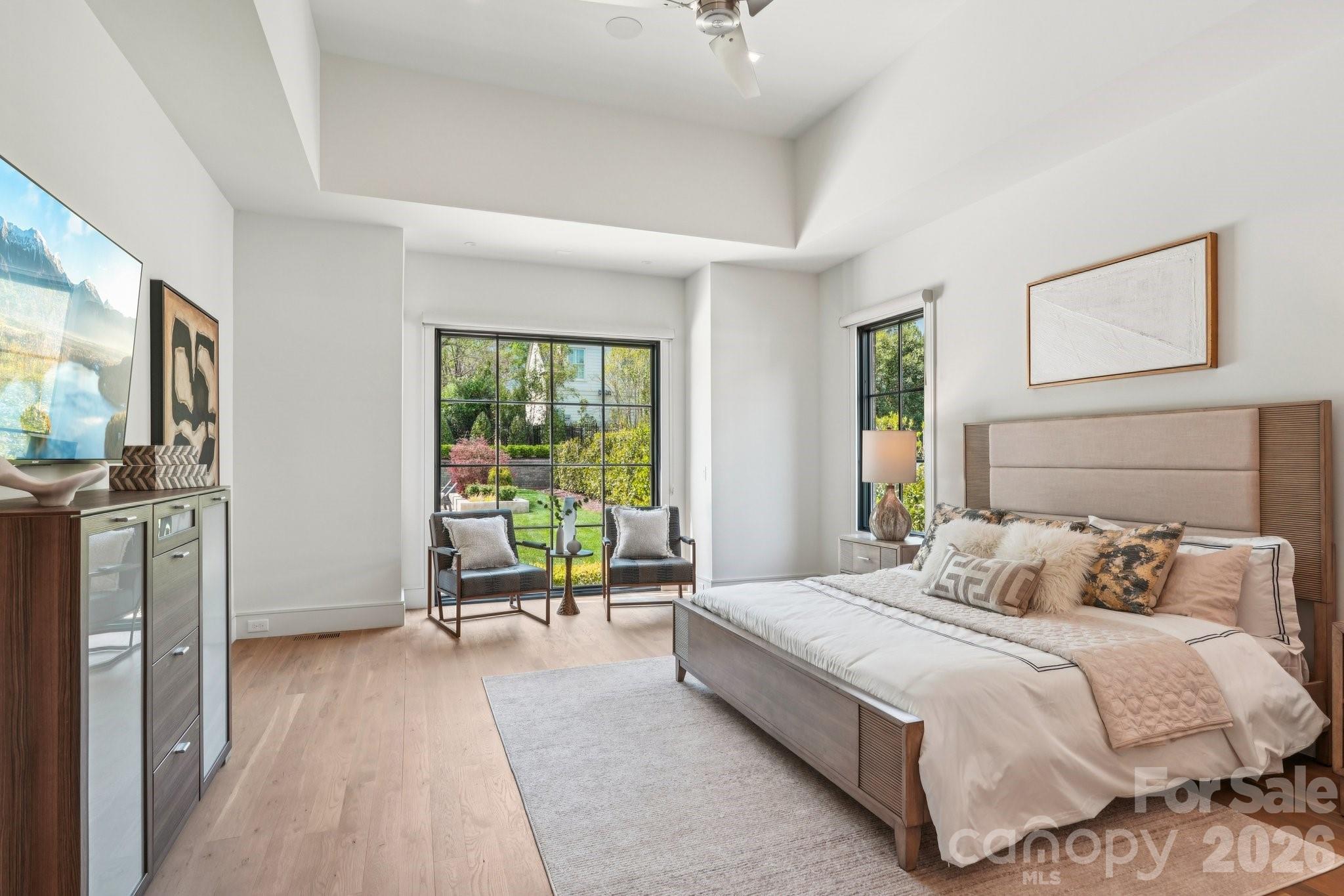 2103 Cortelyou Road Charlotte, NC 28211 - Photo 17 of 45 a bedroom with a bed couch and a window