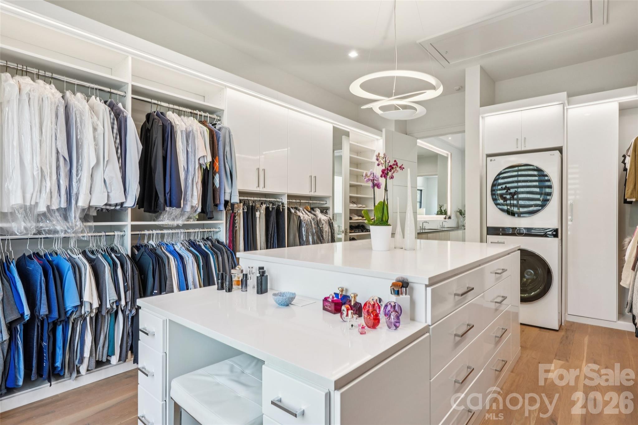 2103 Cortelyou Road Charlotte, NC 28211 - Photo 20 of 45 a very nice looking dining room with kitchen island white cabinets and a wooden floor