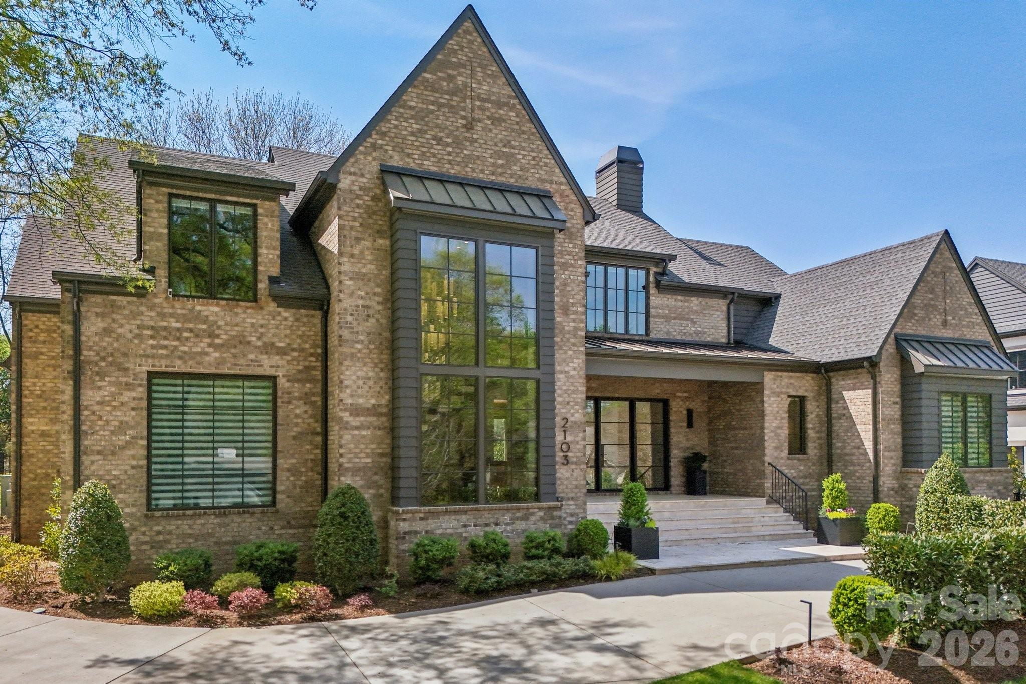 2103 Cortelyou Road Charlotte, NC 28211 - Photo 2 of 45 a front view of a house with garden
