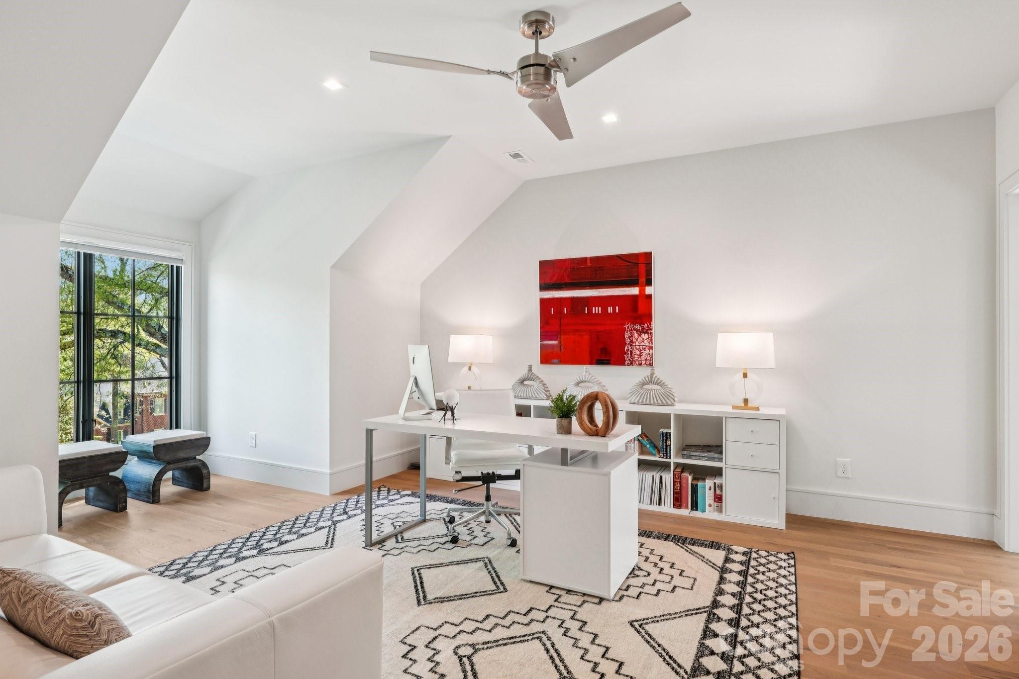 2103 Cortelyou Road Charlotte, NC 28211 - Photo 26 of 45 a living room with furniture a rug and a window