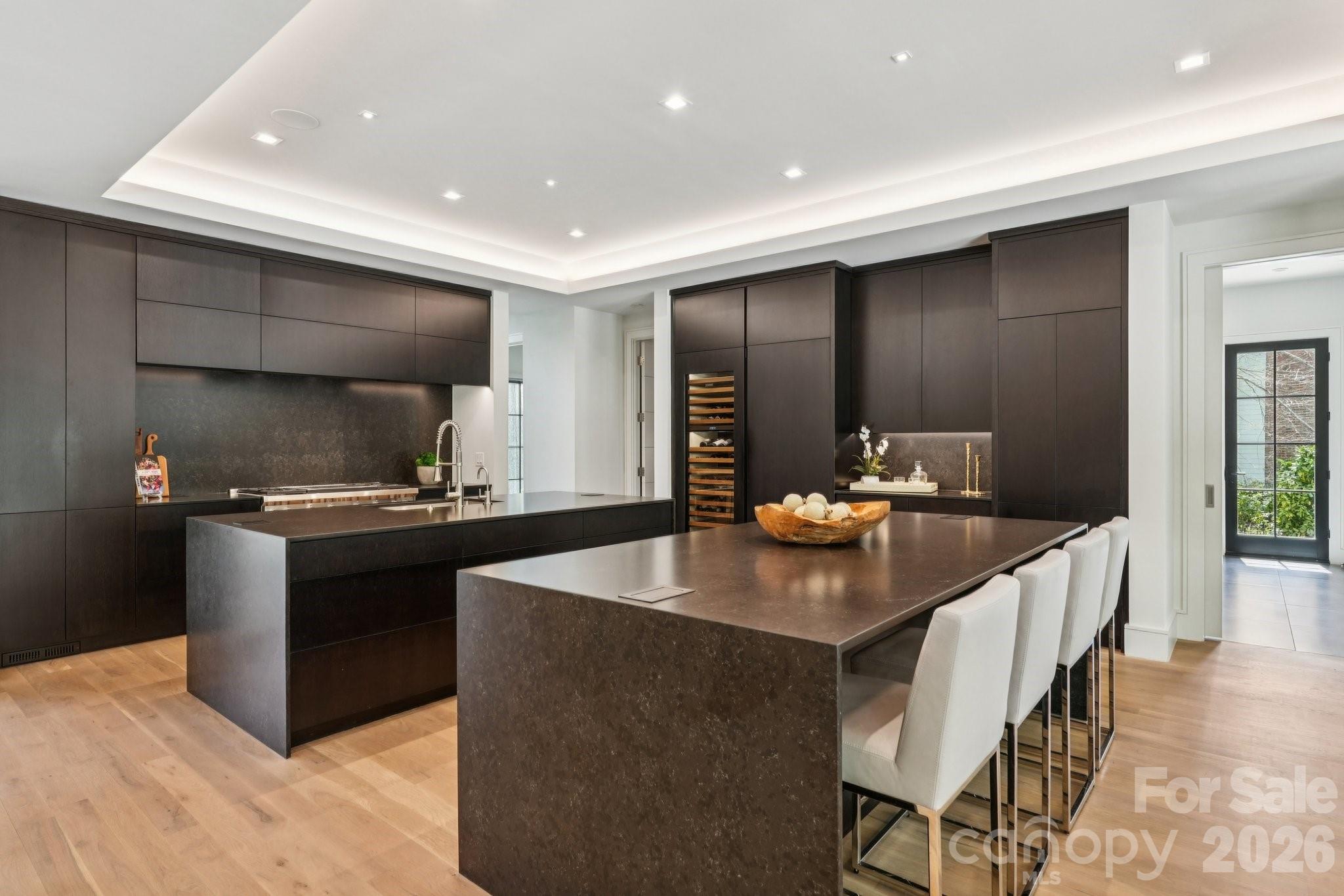 2103 Cortelyou Road Charlotte, NC 28211 - Photo 5 of 45 a kitchen with stainless steel appliances kitchen island granite countertop a sink and a stove