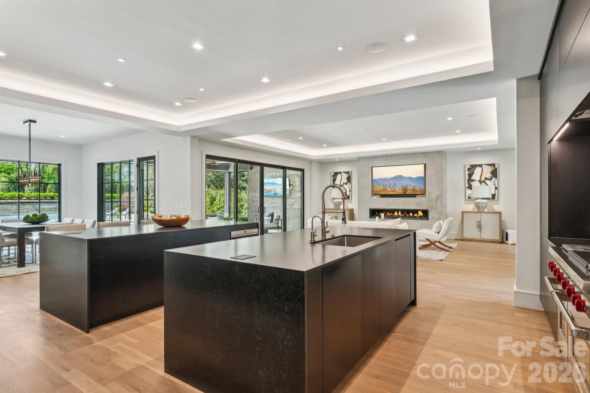 2103 Cortelyou Road Charlotte, NC 28211 - Photo 6 of 45 a living room with kitchen island furniture and a flat screen tv