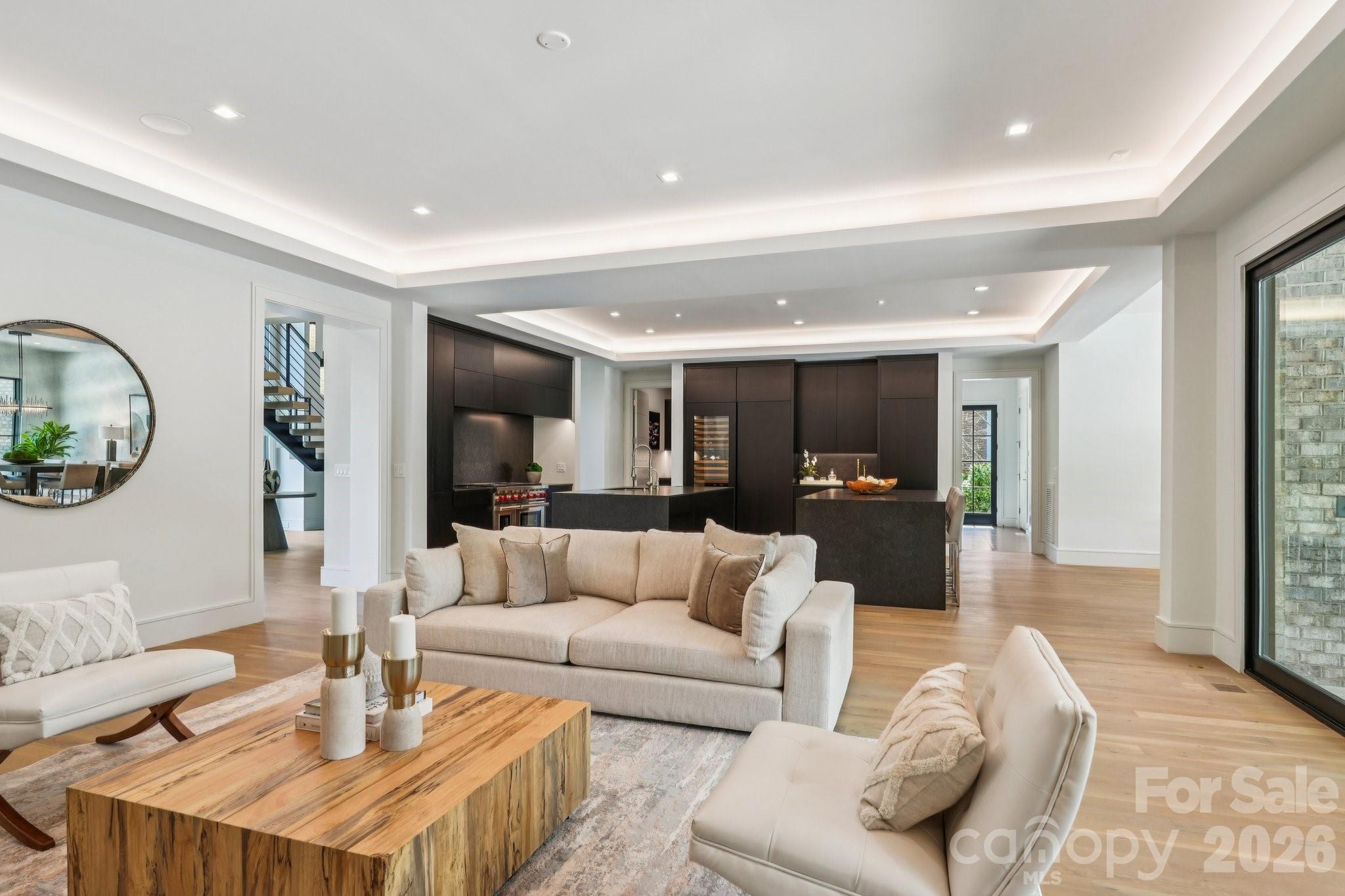 2103 Cortelyou Road Charlotte, NC 28211 - Photo 10 of 45 a living room with furniture and a wooden floor
