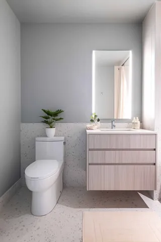 a bathroom with a tub sink and a mirror