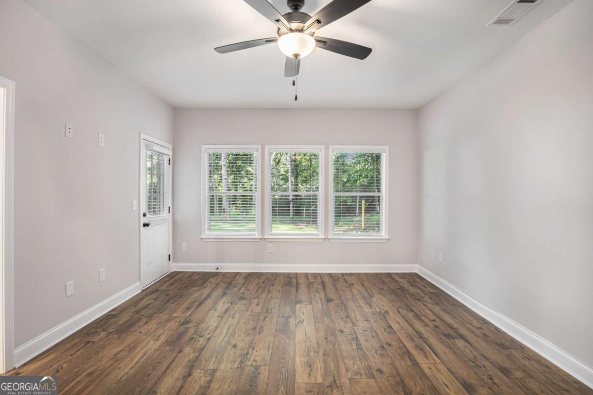 138 Crest Pointe Bremen, GA 30110 - Photo 14 of 24 a view of wooden floor and chandelier fan in a room