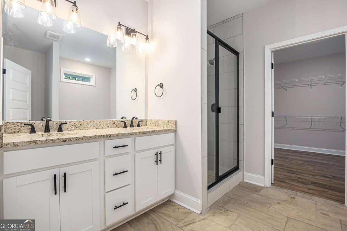 138 Crest Pointe Bremen, GA 30110 - Photo 18 of 24 a bathroom with a granite countertop sink mirror and double