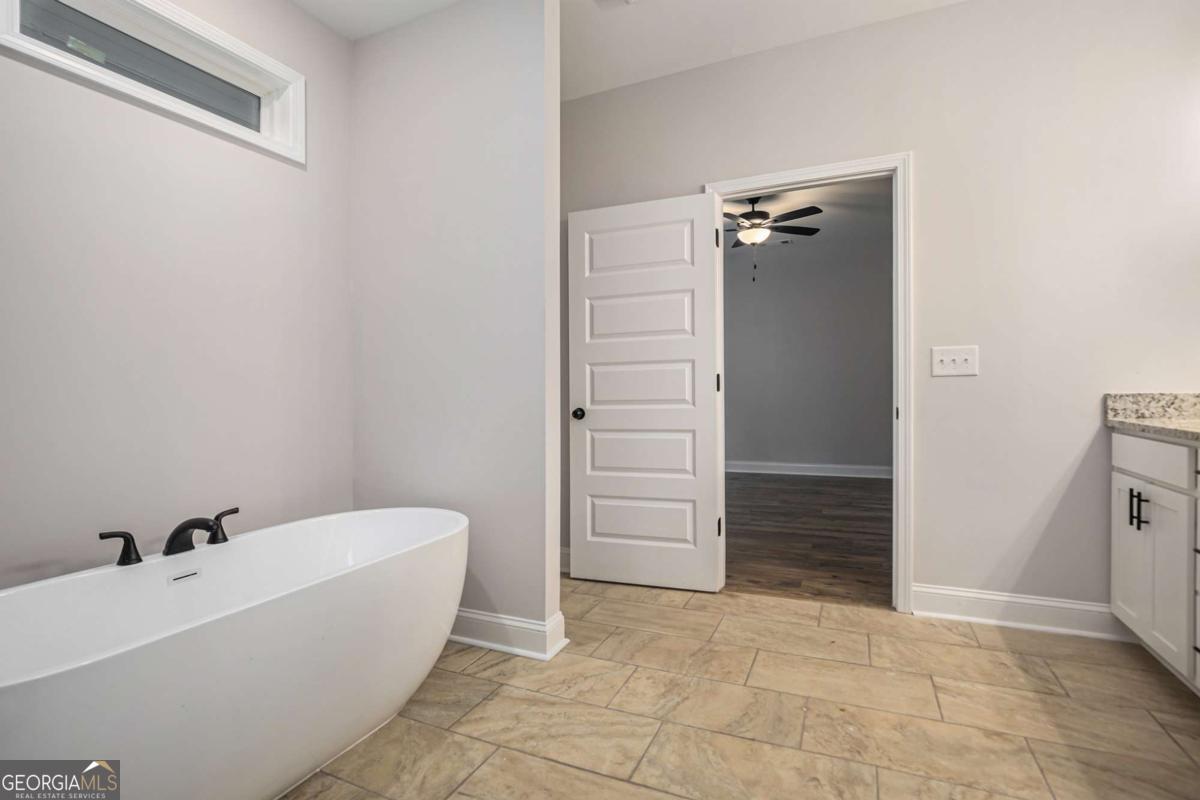 138 Crest Pointe Bremen, GA 30110 - Photo 20 of 24 a bathroom with a bathtub and toilet