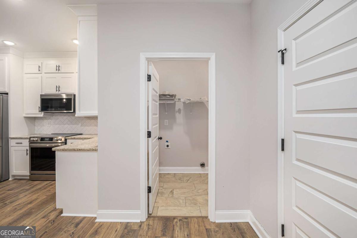138 Crest Pointe Bremen, GA 30110 - Photo 8 of 24 a kitchen with a refrigerator and a stove top oven
