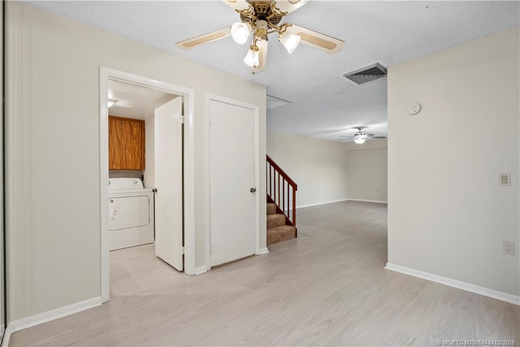 2930 Southwest Sunset Trace Circle Palm City, FL 34990 - Photo 8 of 31 a view of a chandelier fan and entryway