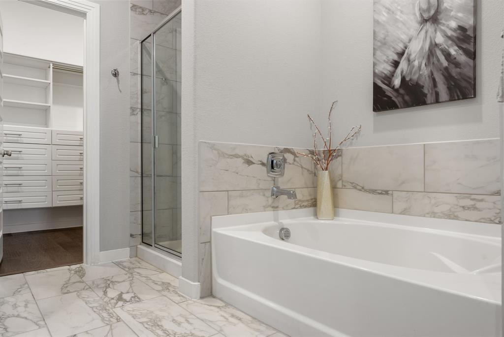 1908 Quail Lane Argyle, TX 76226 - Photo 17 of 30 a bathroom with a bathtub and a shower