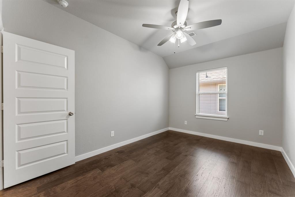 1908 Quail Lane Argyle, TX 76226 - Photo 18 of 30 wooden floor in an empty room with a window