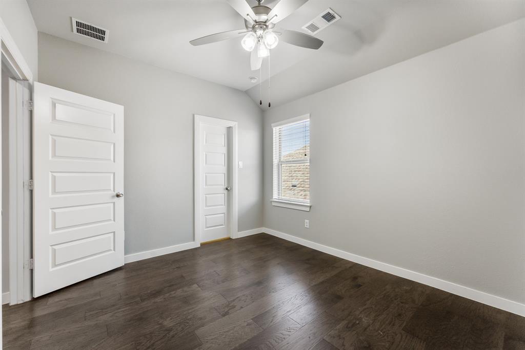 1908 Quail Lane Argyle, TX 76226 - Photo 22 of 30 wooden floor in an empty room with a window