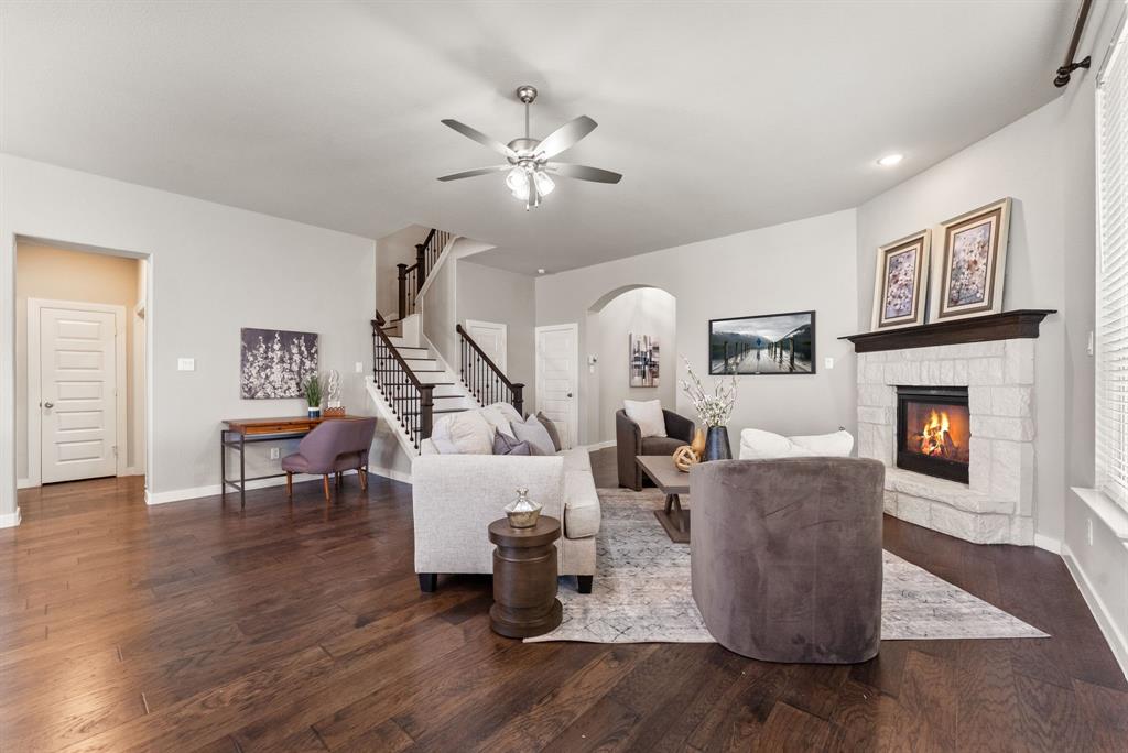 1908 Quail Lane Argyle, TX 76226 - Photo 5 of 30 a living room with furniture and a fireplace