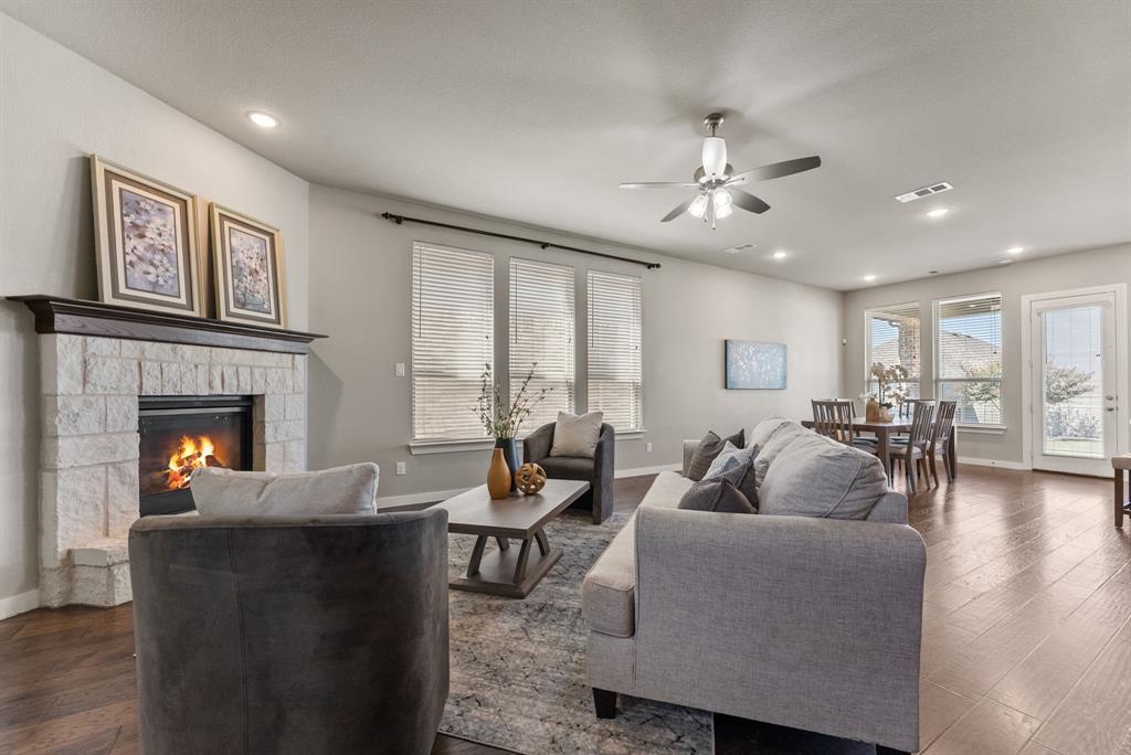 1908 Quail Lane Argyle, TX 76226 - Photo 6 of 30 a living room with furniture and a fireplace