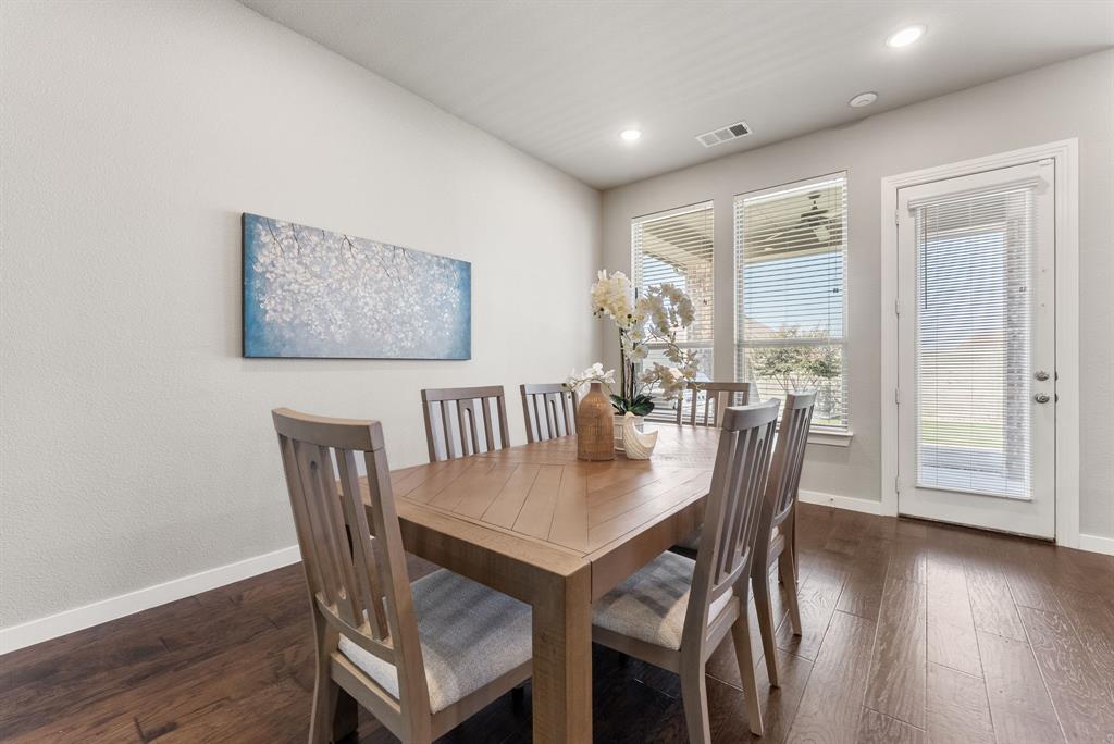 1908 Quail Lane Argyle, TX 76226 - Photo 9 of 30 a view of a dining room with furniture window and wooden floor