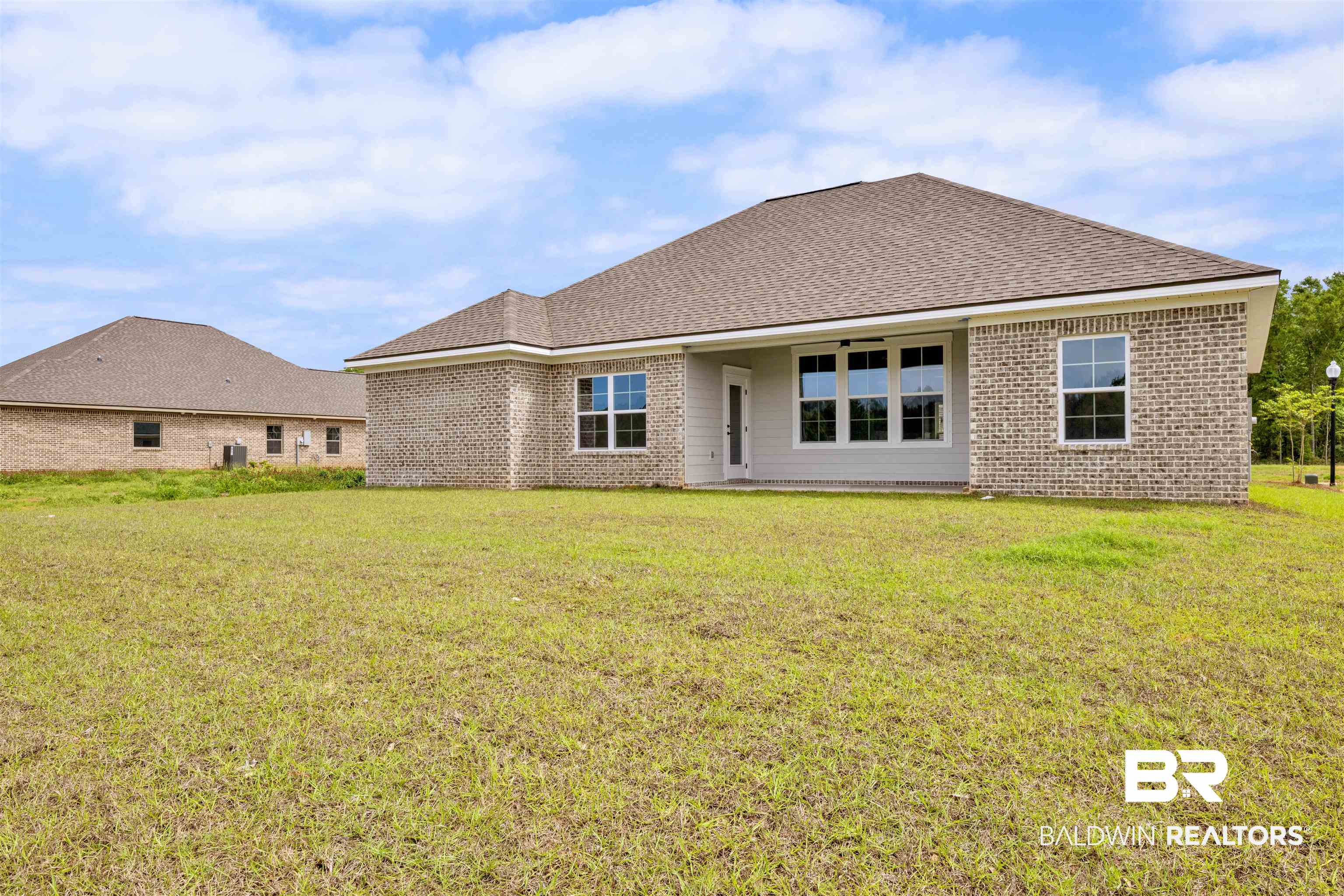 27315 Patch Pl Loop Daphne, AL 36526 - Photo 27 of 43 Rear view of property with a yard, brick siding, and a patio