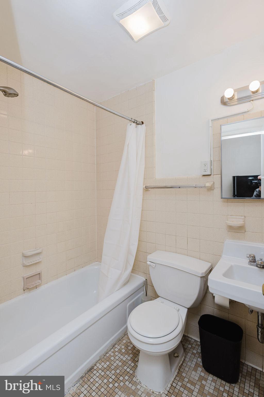 2318 South Broad Street Philadelphia, PA 19145 - Photo 14 of 28 a bathroom with a sink toilet and shower