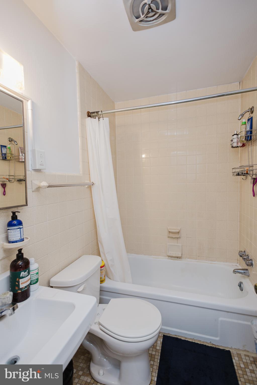2318 South Broad Street Philadelphia, PA 19145 - Photo 19 of 28 a bathroom with a sink a toilet and a bathtub