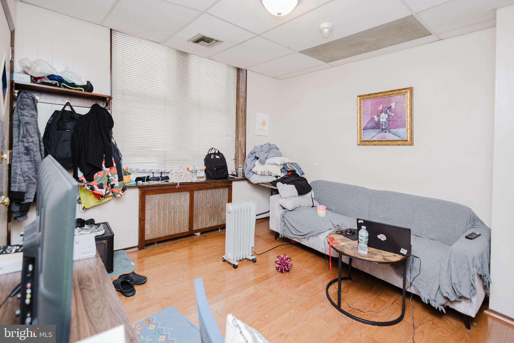 2318 South Broad Street Philadelphia, PA 19145 - Photo 5 of 28 a room with gym equipment and a window